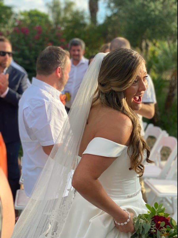 Bride in the aisle with bouquet